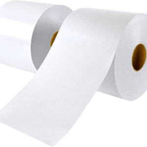Three rolls of blank white label material with one strip unrolled